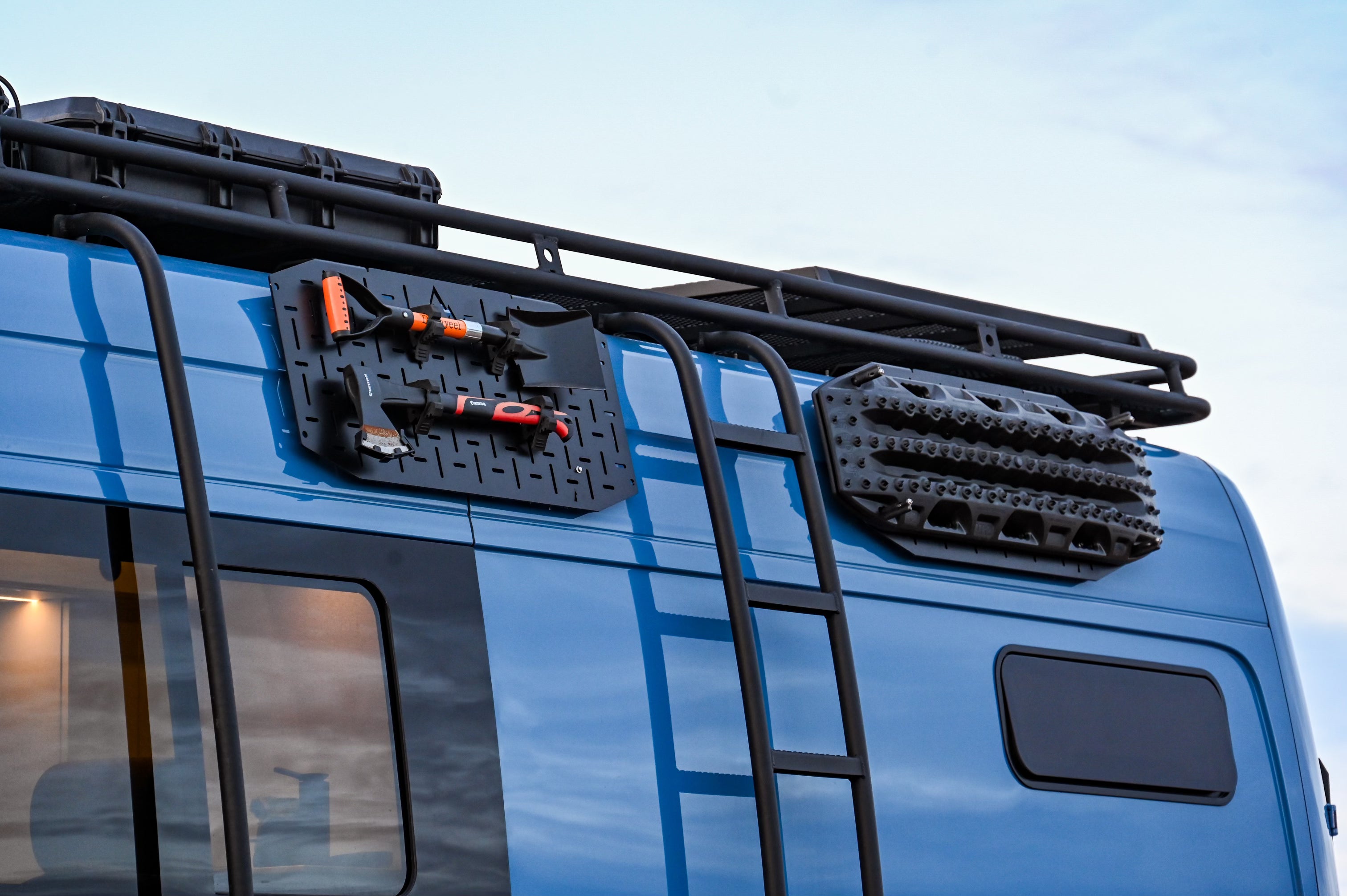 Close-up of Alpine Van Works Alpaca Cargo Plate™️ for Sprinter exterior component showing durable aluminum construction and branding.