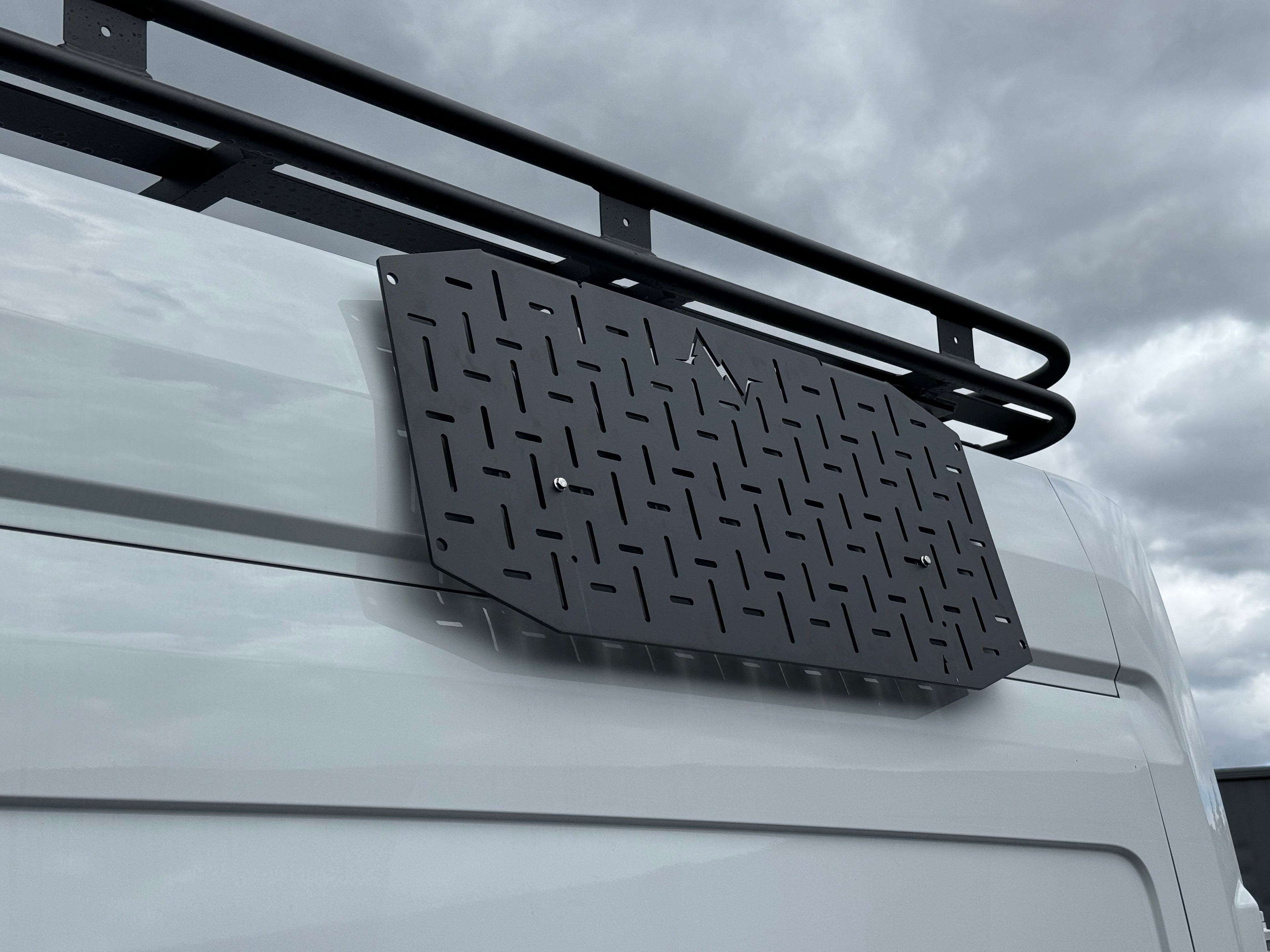 Alpine Van Works LLC Alpaca Cargo Plate for Transit van exterior component, durable aluminum cargo protection plate.