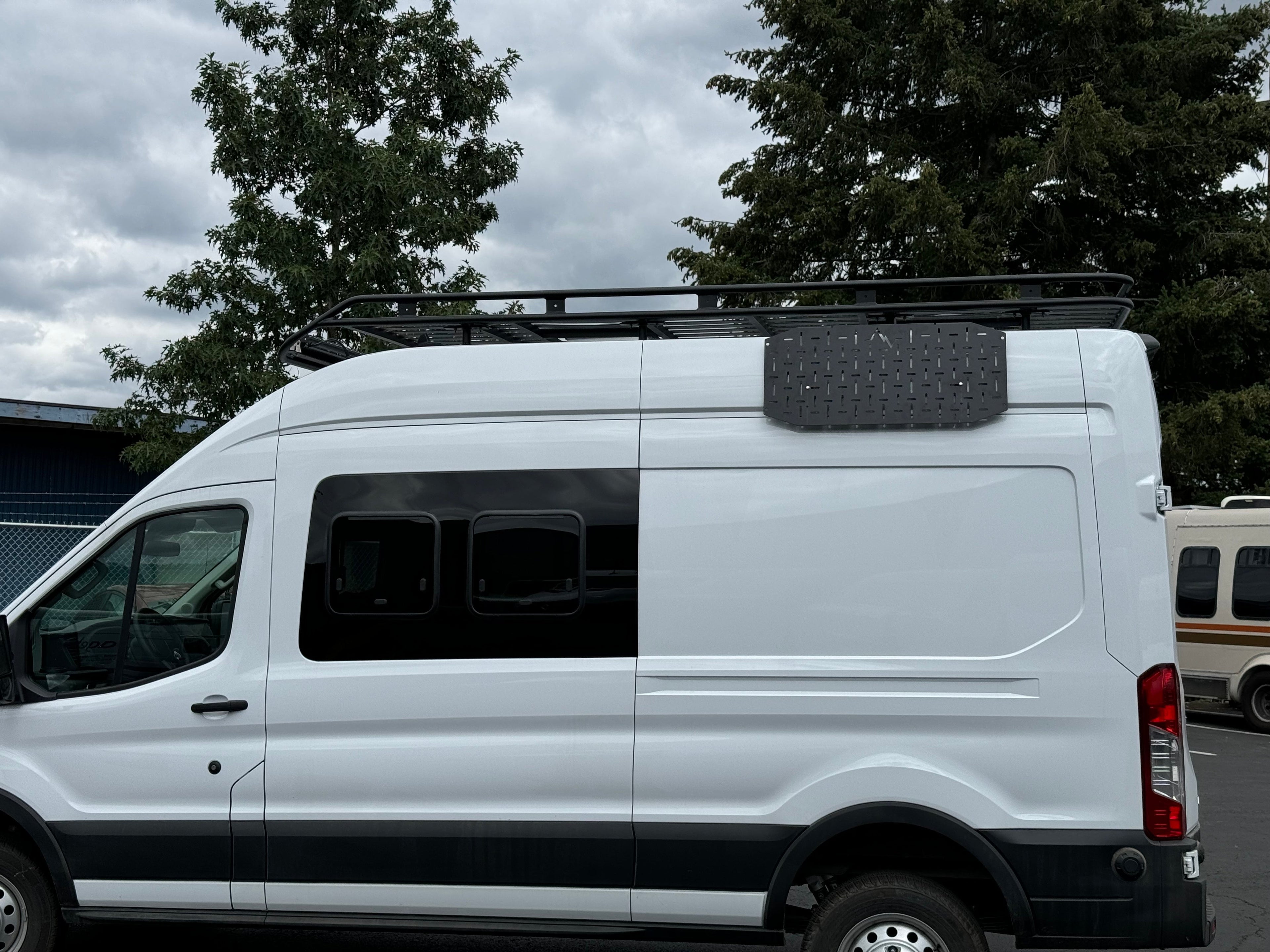 Alpine Van Works Alpaca Cargo Plate for Transit van exterior component with sturdy aluminum design and mounting brackets.