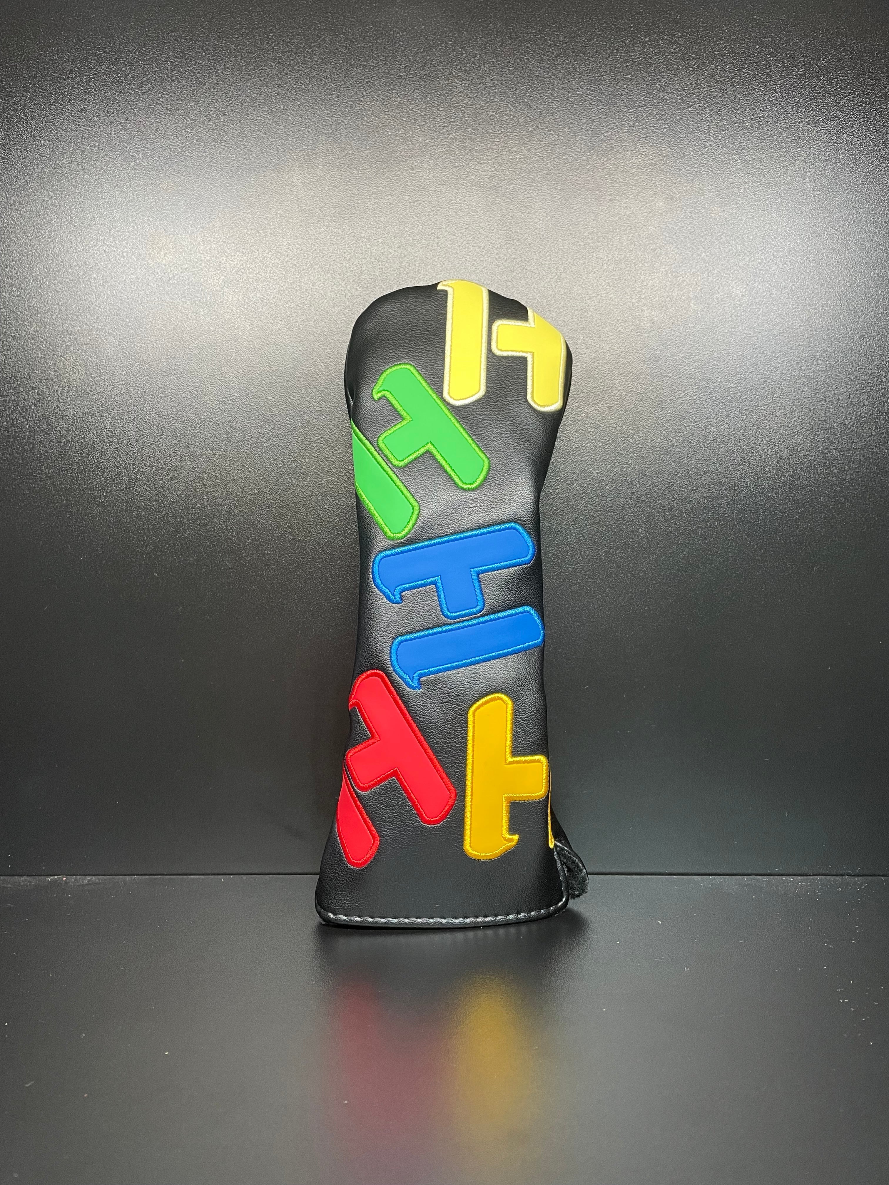 Golf club headcover featuring colorful alphabet letters by ParWestGolf, designed to protect and personalize golf clubs.