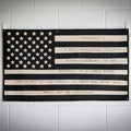 American flag design on combat boot leather by Recycled Firefighter, featuring rugged texture and patriotic colors.