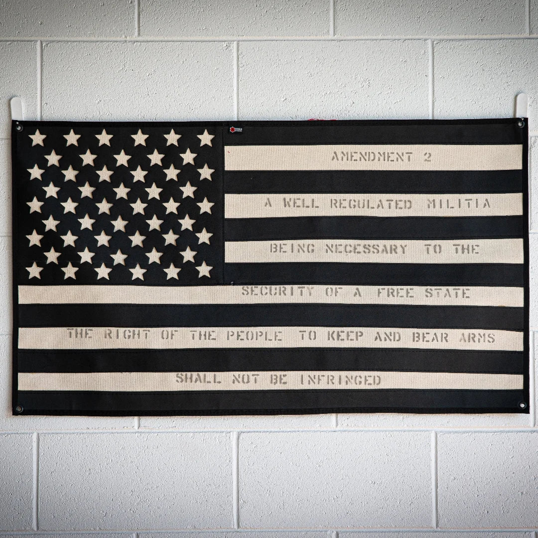 American flag design on combat boot leather by Recycled Firefighter, featuring rugged texture and patriotic colors.