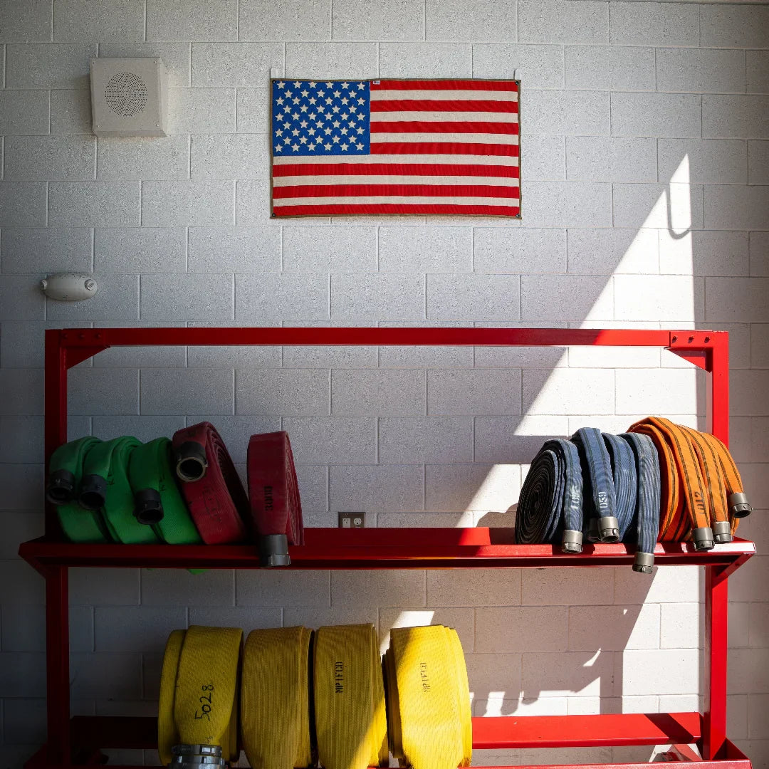 American flag made from fire hose by Recycled Firefighter, showcasing vibrant colors and unique texture.
