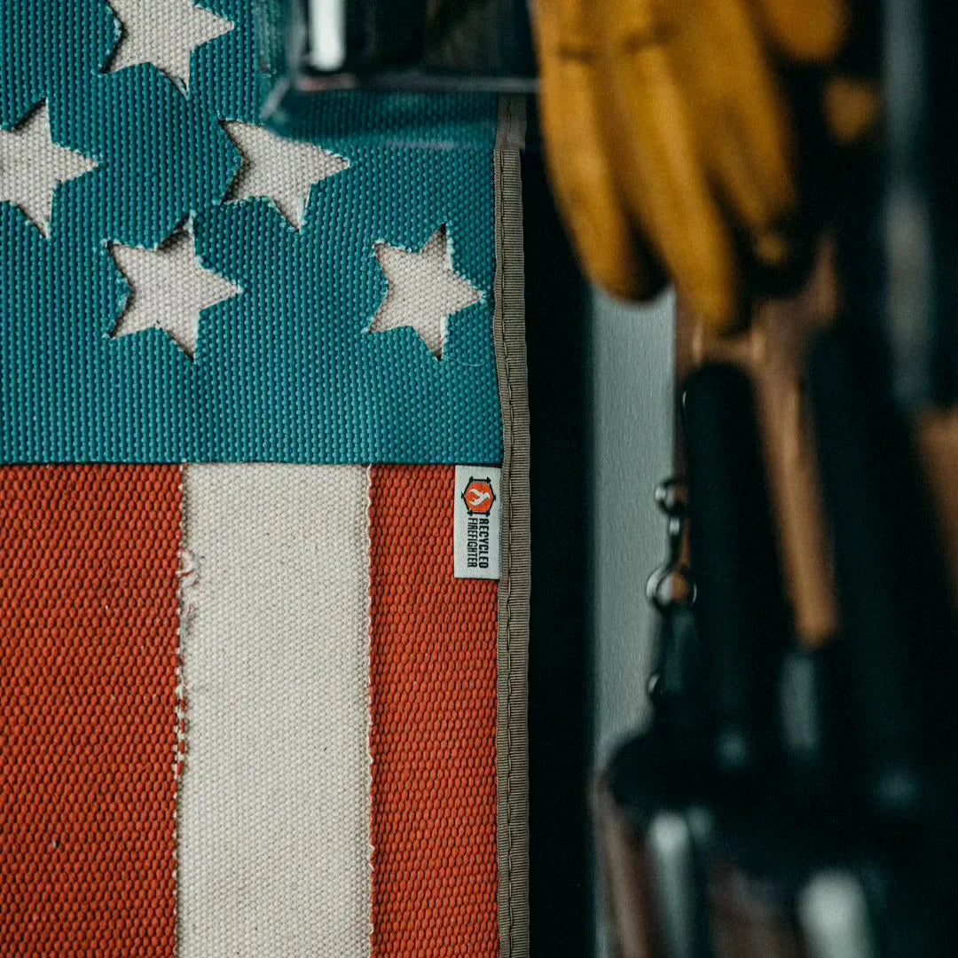 American flag made from fire hose by Recycled Firefighter, showcasing vibrant colors and unique texture.
