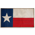 American flag made from fire hose with Texas state design by Recycled Firefighter on white background.