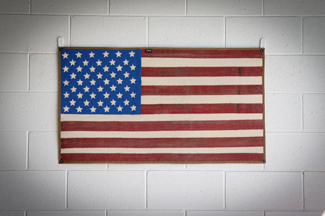 Vintage American flag made from recycled fire hose by Recycled Firefighter, showcasing a patriotic and eco-friendly design.