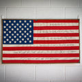 American flag made from recycled fire hose with Second Amendment text, by Recycled Firefighter, showcasing patriotic and eco-friendly design.