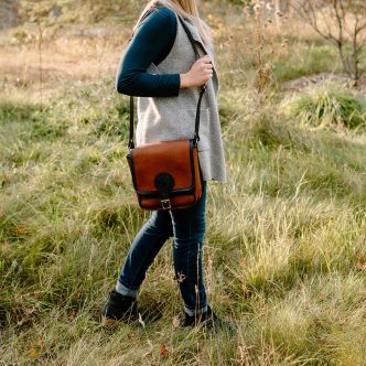 Backcountry Sportsman Bison Leather Mini Haversack featuring a compact design with a leather strap and detailed stitching.