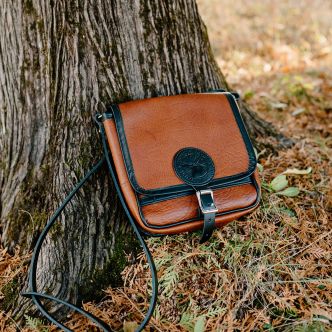Backcountry Sportsman Bison Leather Mini Haversack with adjustable strap and compact design, shown in close-up shot.