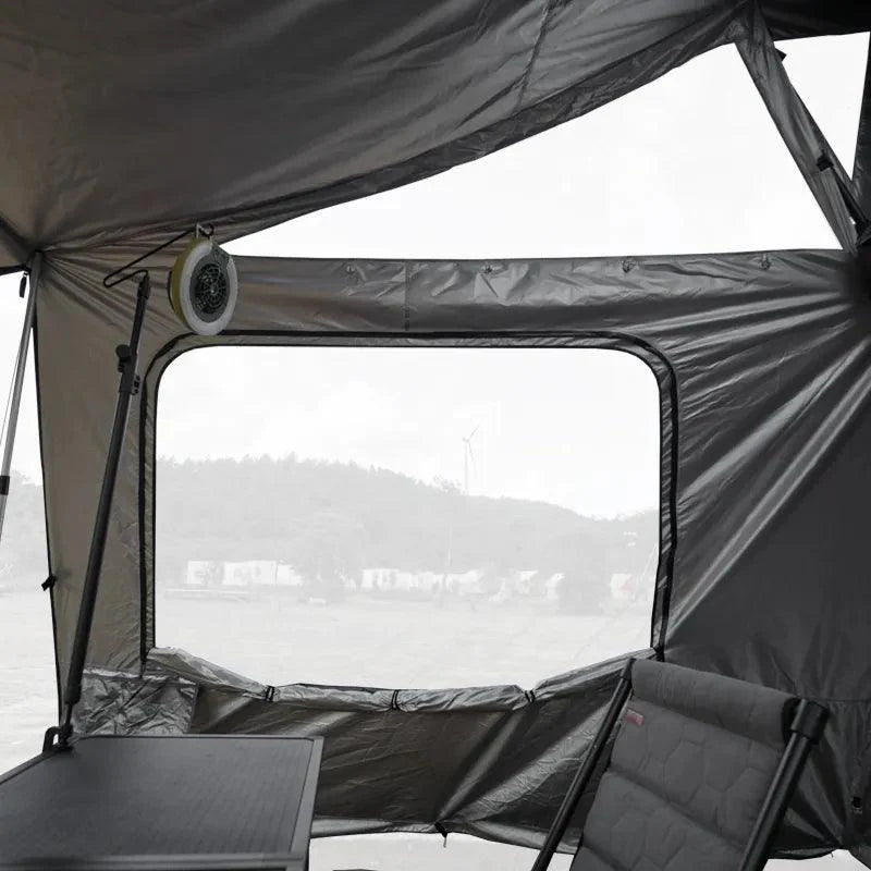 Wild Land annex side car awning attached to OrthFrame Summit Explorer roof tent, overlanding gear for outdoor adventures