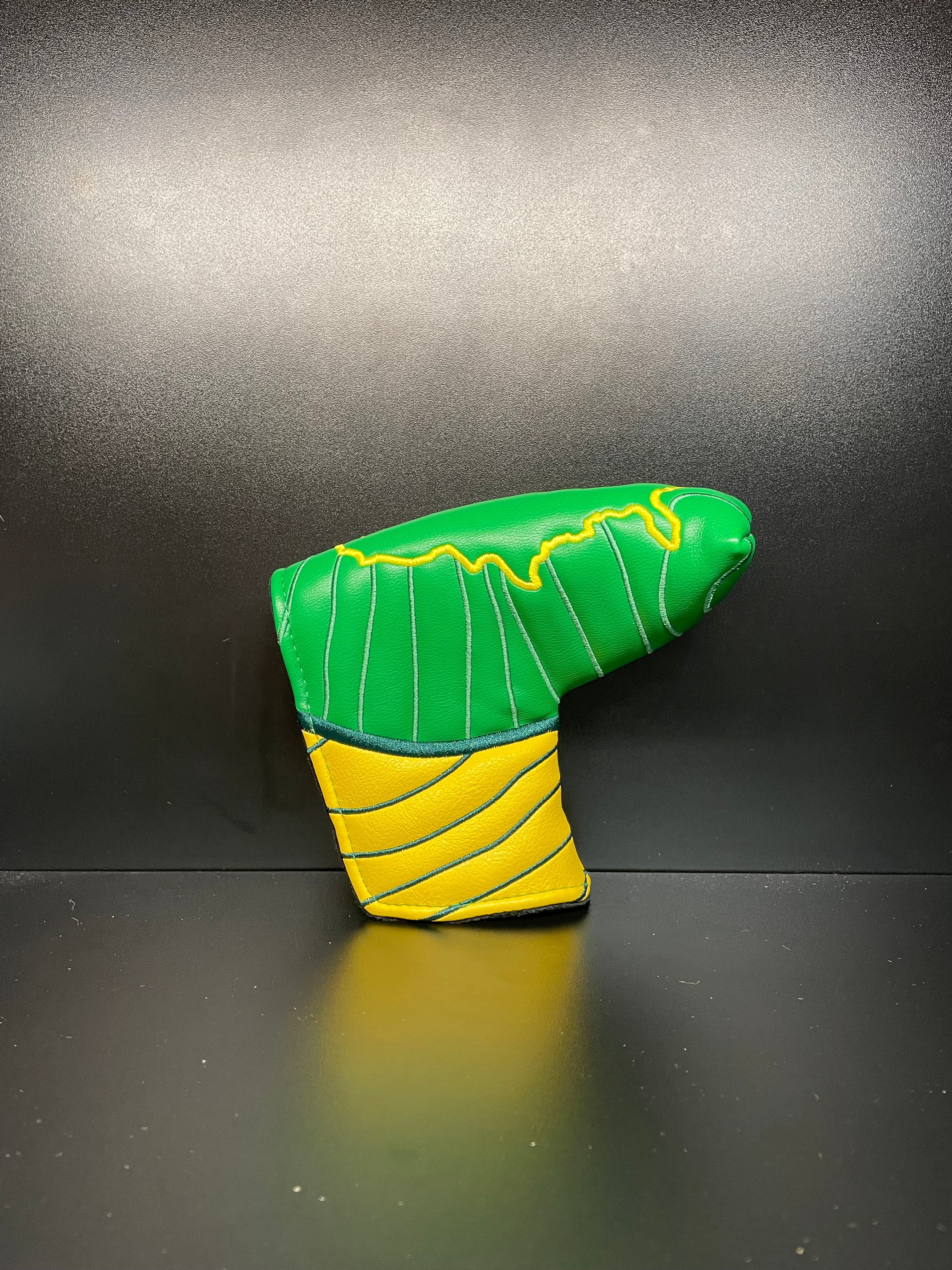 Approaching Masters golf club headcover by ParWestGolf featuring a detailed design in green and black for protective coverage.