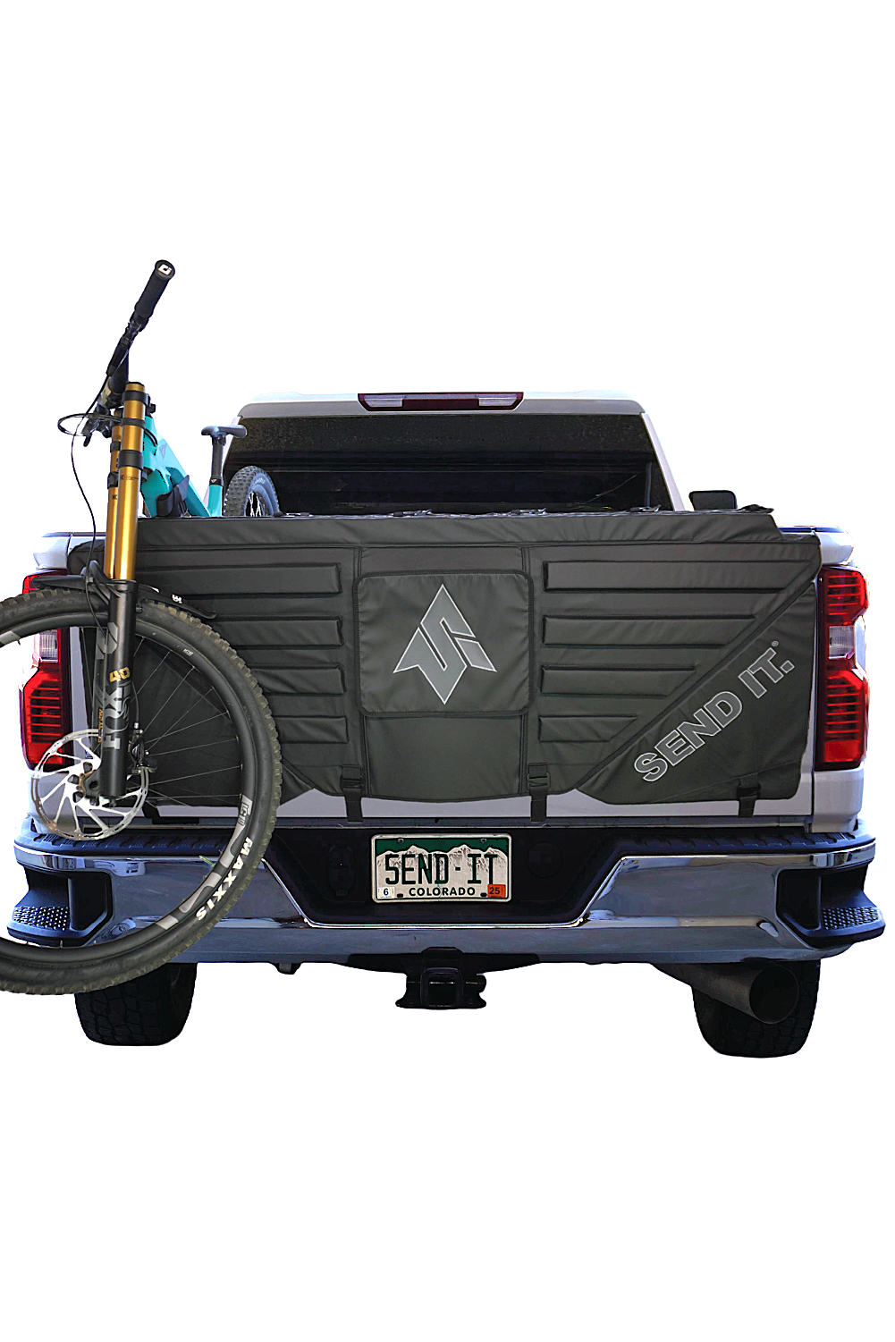Send It High Roller Tailgate Pad V2 shown on a truck tailgate, featuring padded straps and durable construction for truck bed protection.