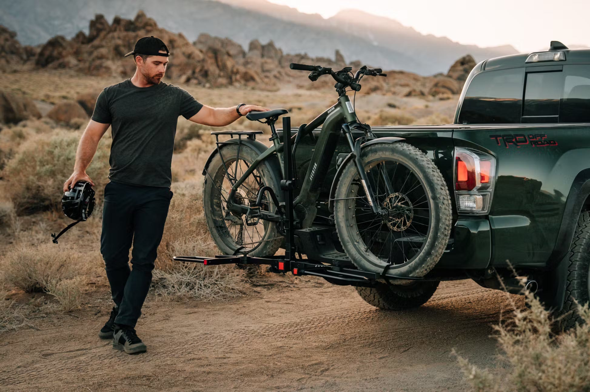 Rex E-Bikes Aventon Aventure.M E-Bike in a scenic outdoor setting, showcasing its sleek frame and mountain bike design.
