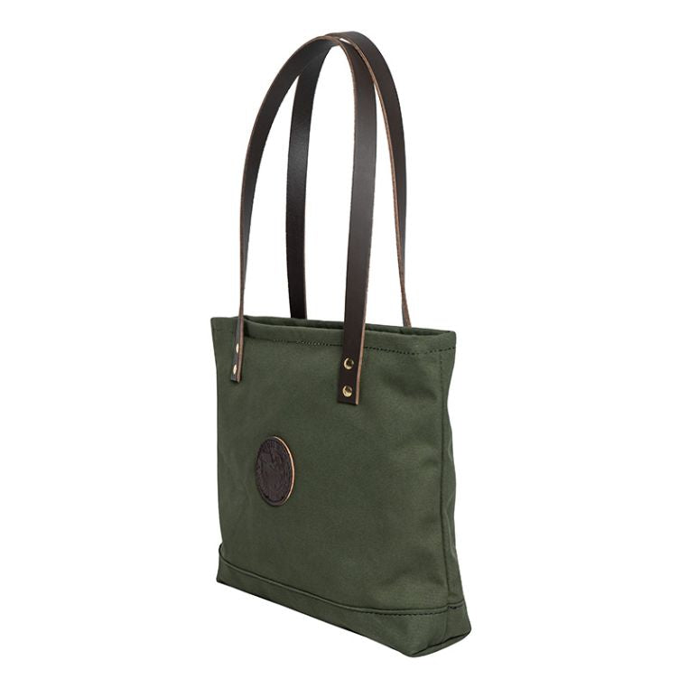 Backcountry Sportsman market tote with side pockets, made of durable fabric, shown with open top and sturdy handles.