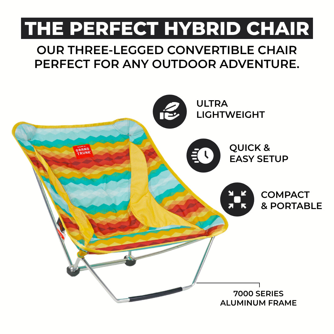 GrandTrunk Mayfly Low Ground Collapsible Chair shown folded and set up, lightweight outdoor seating for camping or relaxing.