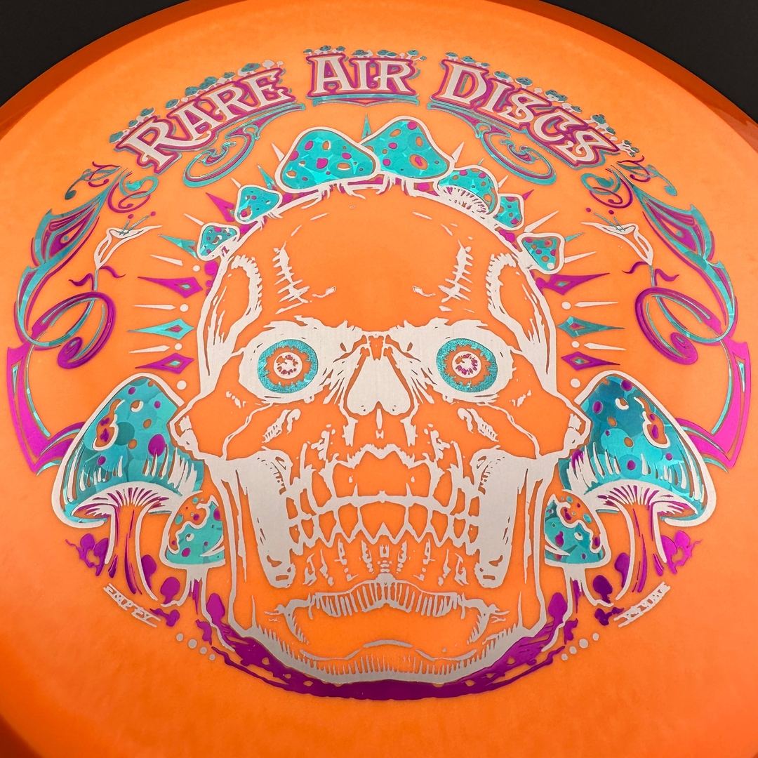 Rare Air Discs Fission Defy Crushin' Amanitas VIP 2.0 disc golf disc with vibrant design and bold branding.