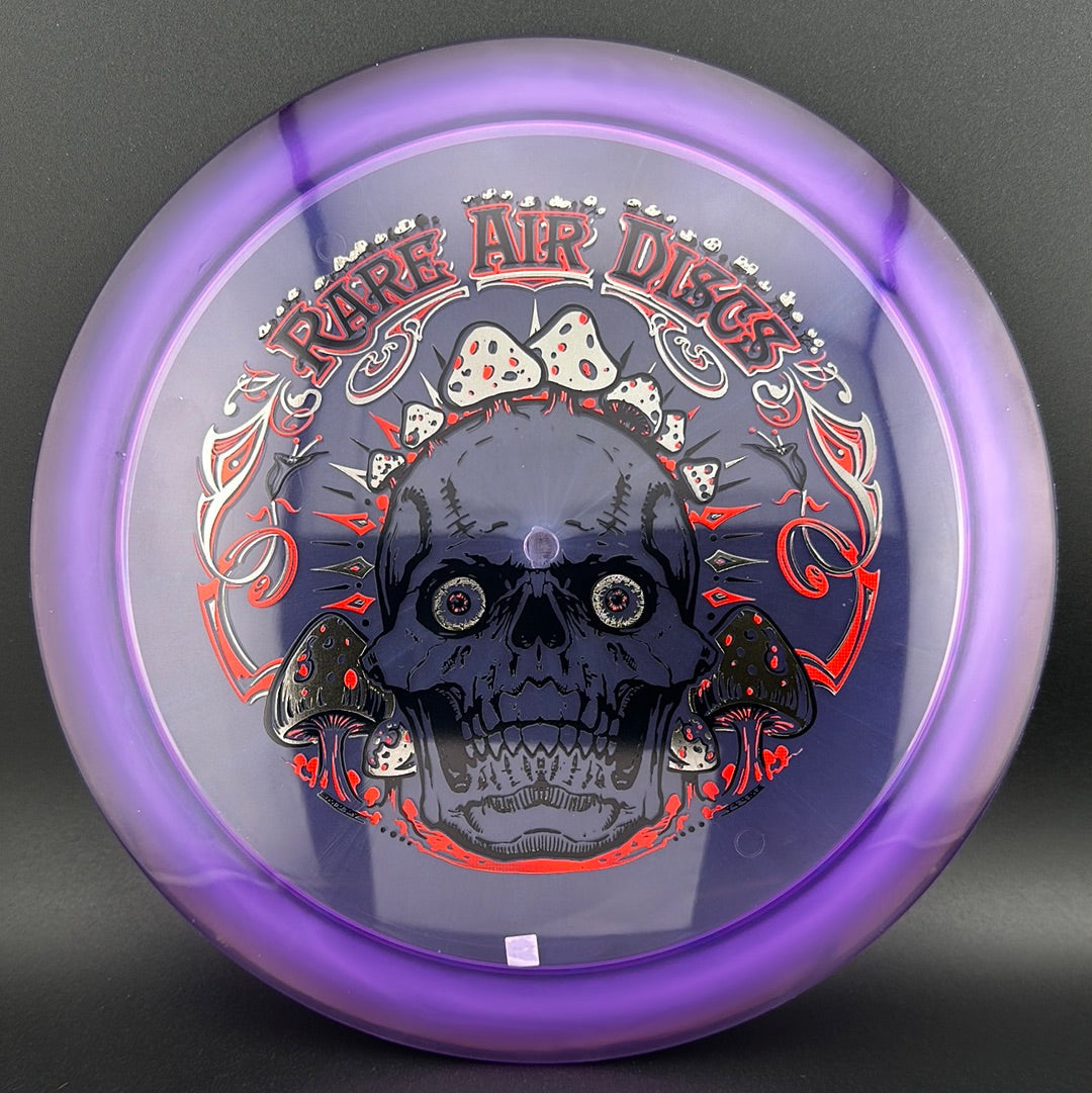 Ethos Construct Crushin' Amanitas disc golf stamp by Manny Trujillo on Rare Air Discs disc, featuring colorful mushroom illustrations.