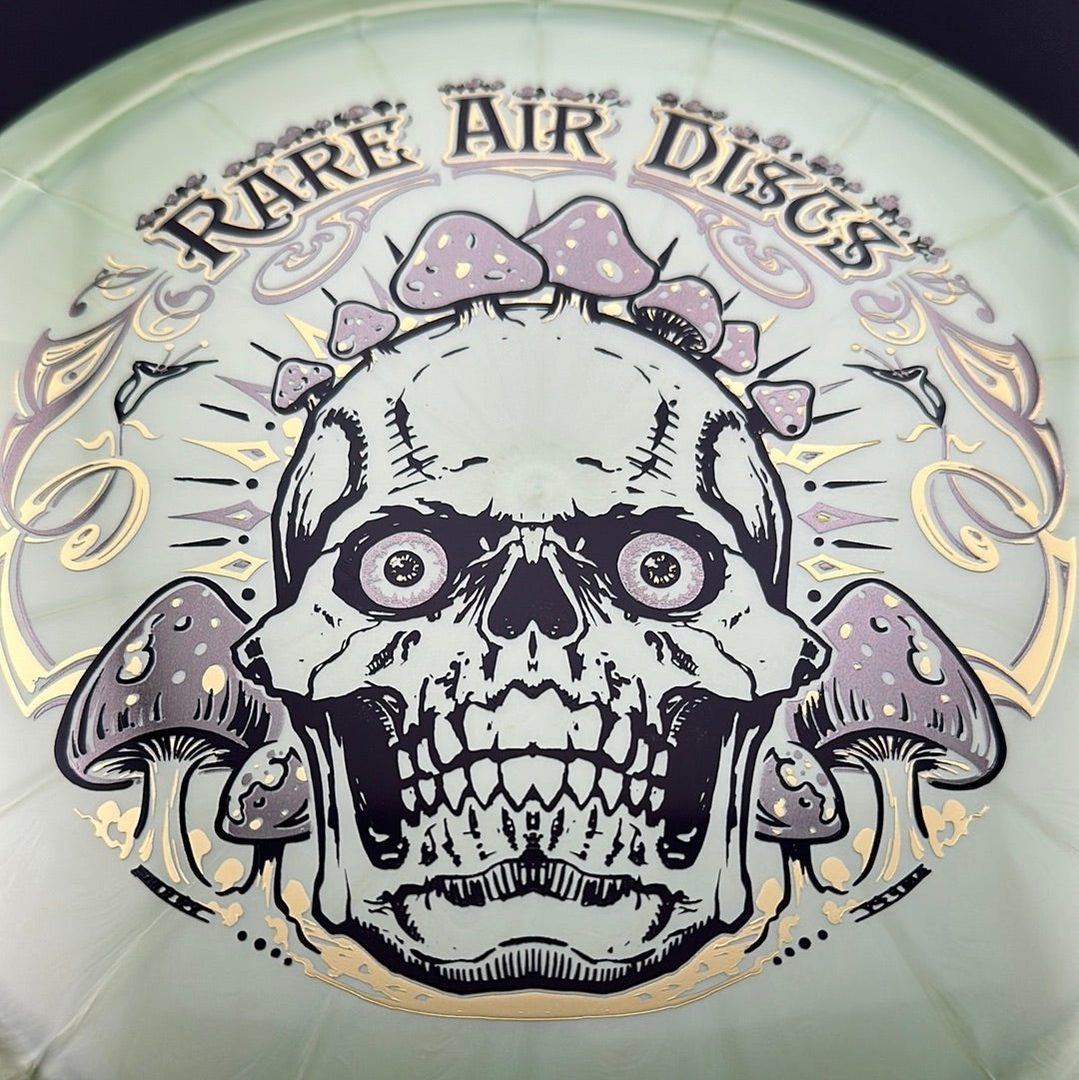 Ethereal Construct Crushin' Amanitas disc golf stamp by Manny Trujillo on a rare air discs disc with vibrant, detailed design.