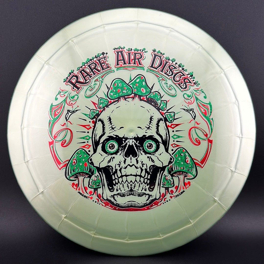 Ethereal Construct Crushin' Amanitas disc golf stamp by Manny Trujillo on a Rare Air Discs disc with colorful mushroom artwork.