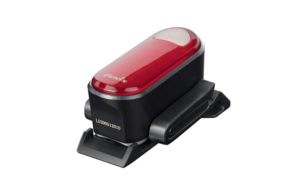 Fenix BC05R V2.0 rechargeable bicycle tail light mounted on a bike, illuminating the rear for enhanced visibility.