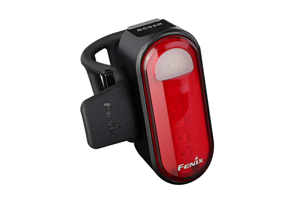Fenix BC05R V2.0 rechargeable bicycle tail light with bright red LED, mounted on a bike for visibility in low light.
