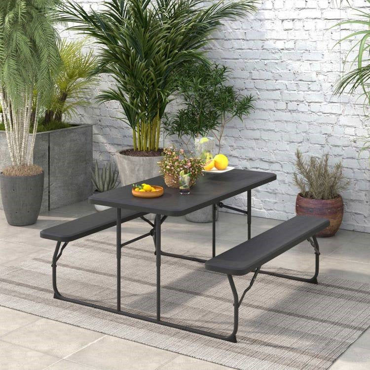 Black folding picnic table with two benches, outdoor patio dining set by HomePacific, ideal for outdoor gatherings and compact storage.