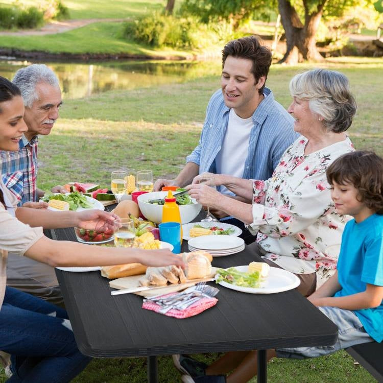 Black folding picnic table with two benches, outdoor patio dining set by HomePacific, suitable for outdoor gatherings and meals.