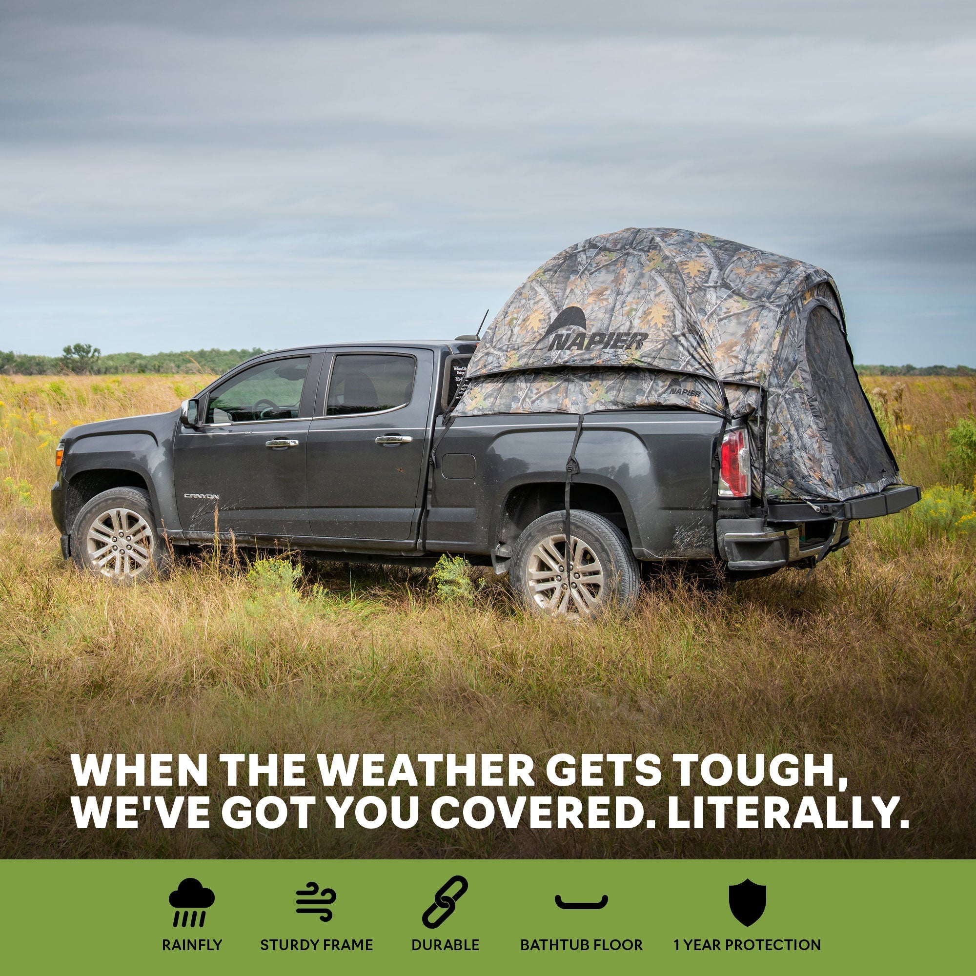 Backcountry Sportsman truck tent set up on a pickup truck in outdoor terrain, showcasing durable fabric and spacious design.