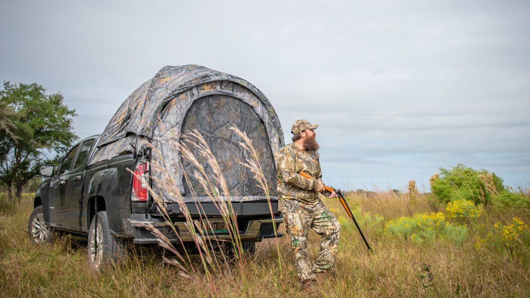 Backcountry Sportsman truck tent set up on a pickup truck, showing the spacious fabric cover and installation details in outdoor setting.