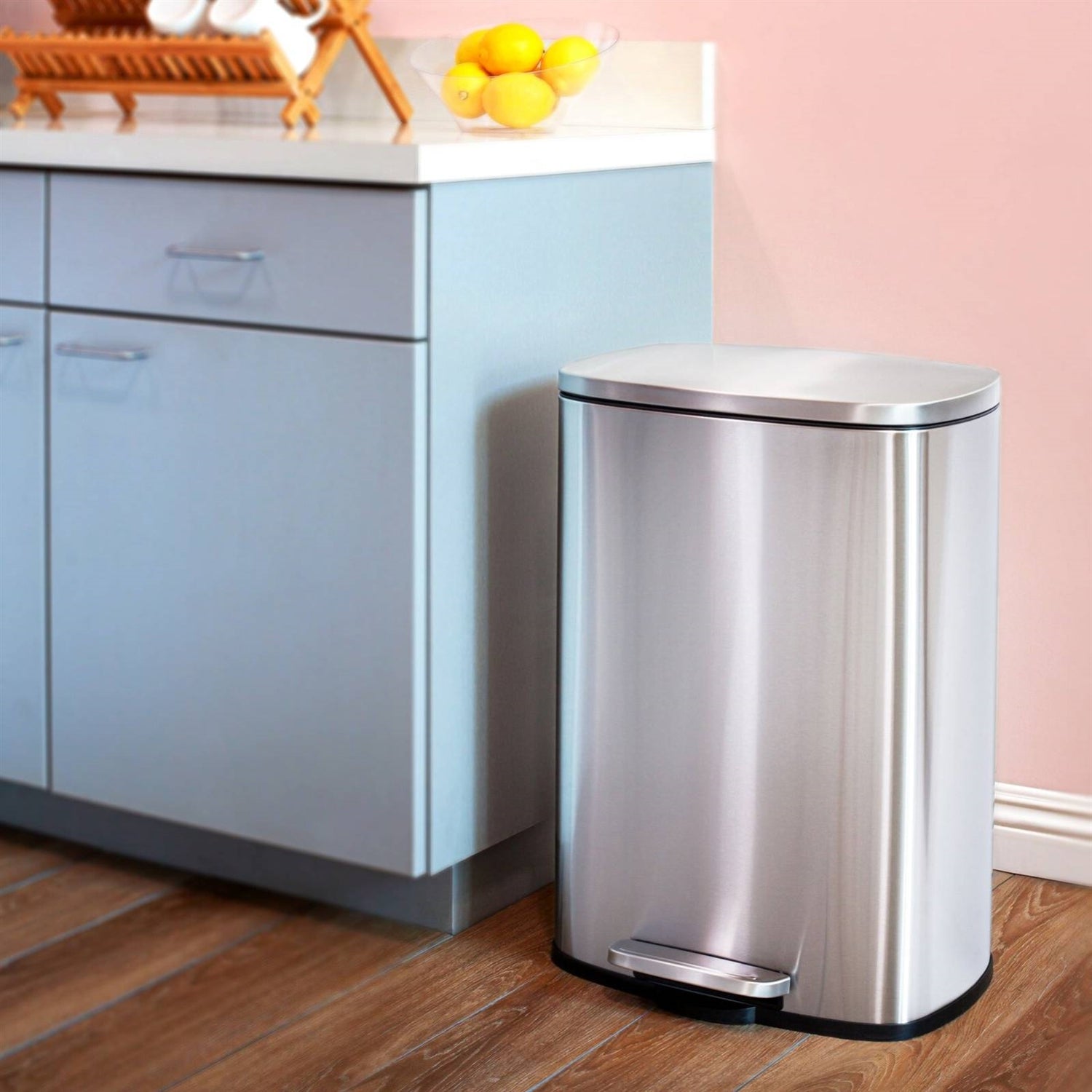 Brushed stainless steel 13-gallon kitchen trash can with step-open lid by HomePacific, featuring modern design and foot pedal for easy use.