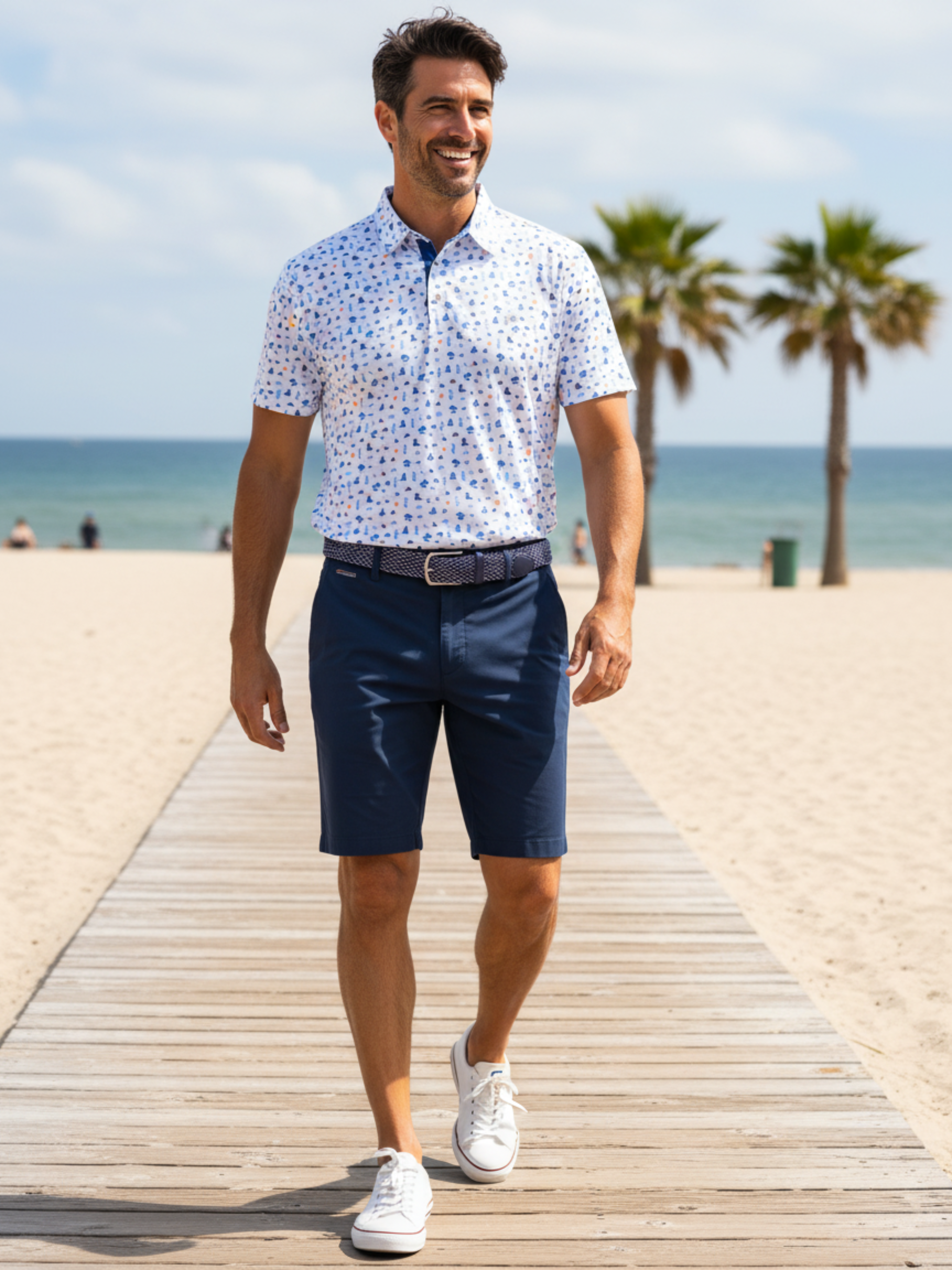 Navy Beachside Polo by White Water Life displayed on a wooden background with beach elements in the scene.