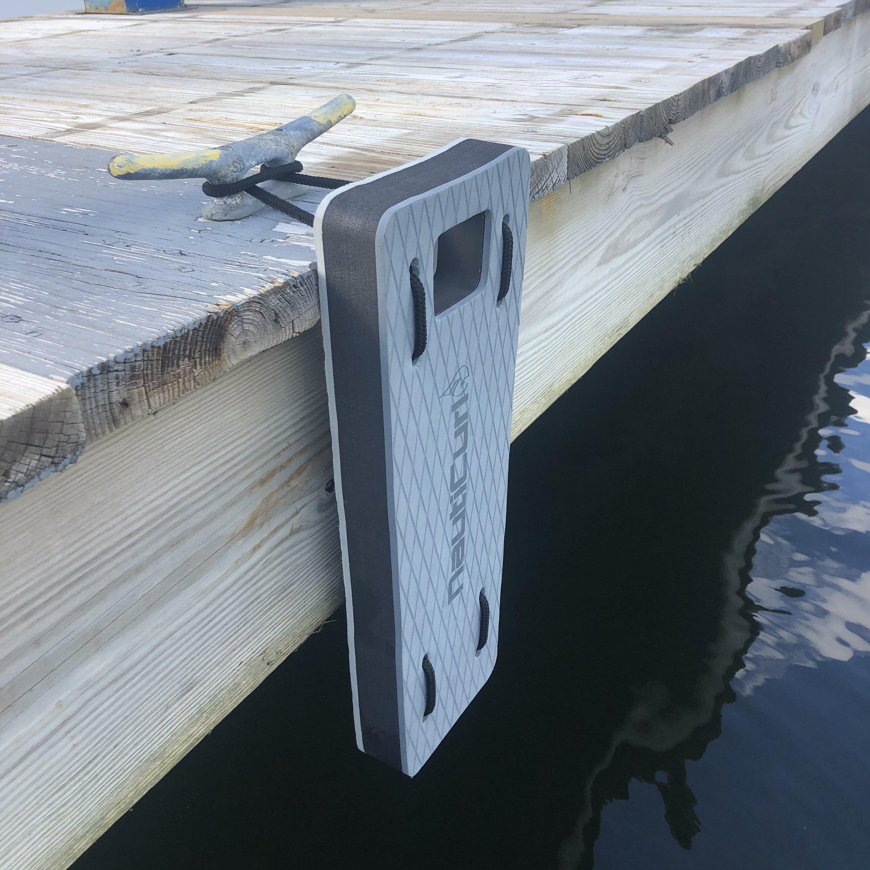 NautiFender flat boat fender made with EVA foam, designed by NautiCurl LLC, shown attached to a boat for protection against docks.