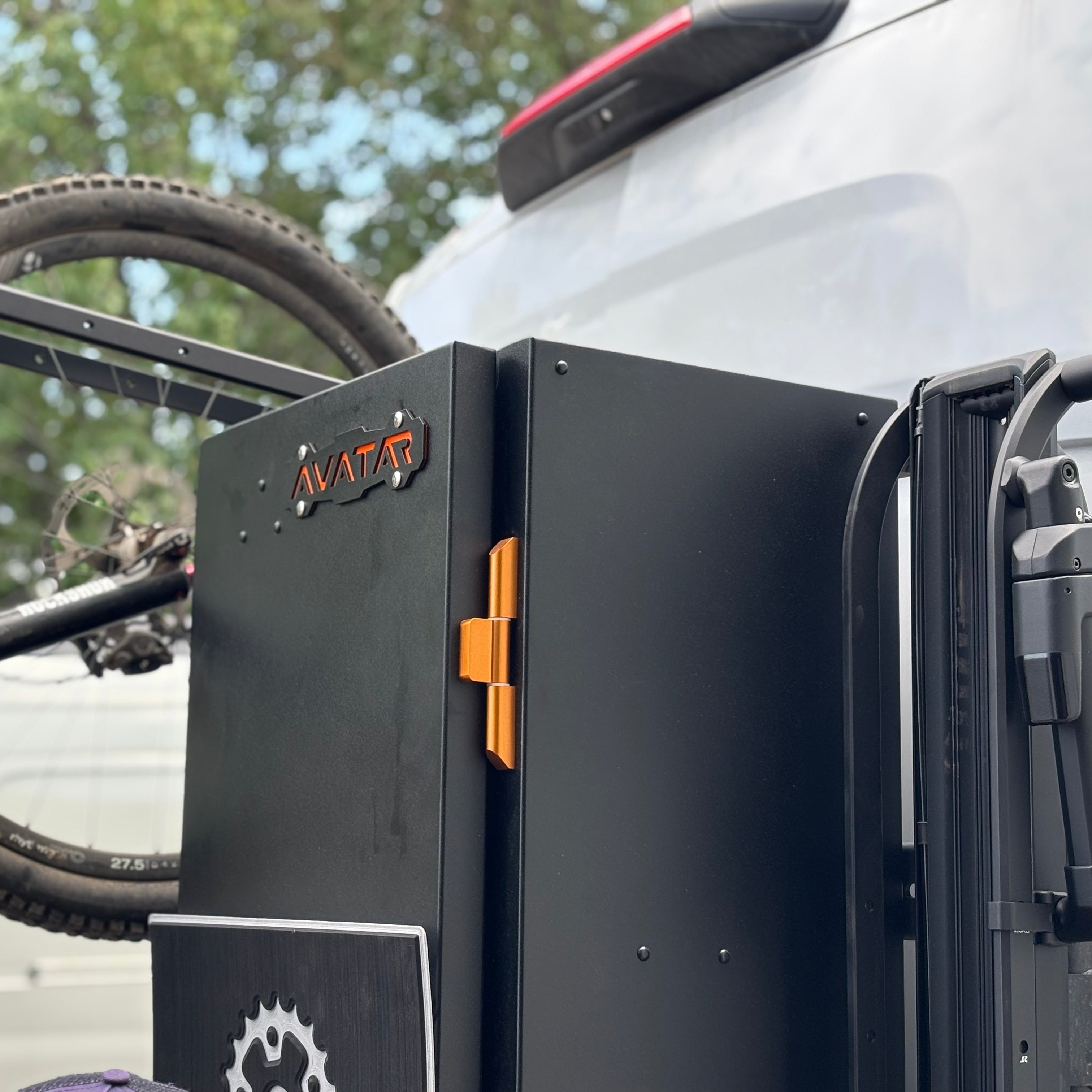 Avatar Offroad Avatar Centi Van Storage Box attached to a van for organized bike storage, durable and secure for outdoor adventures.