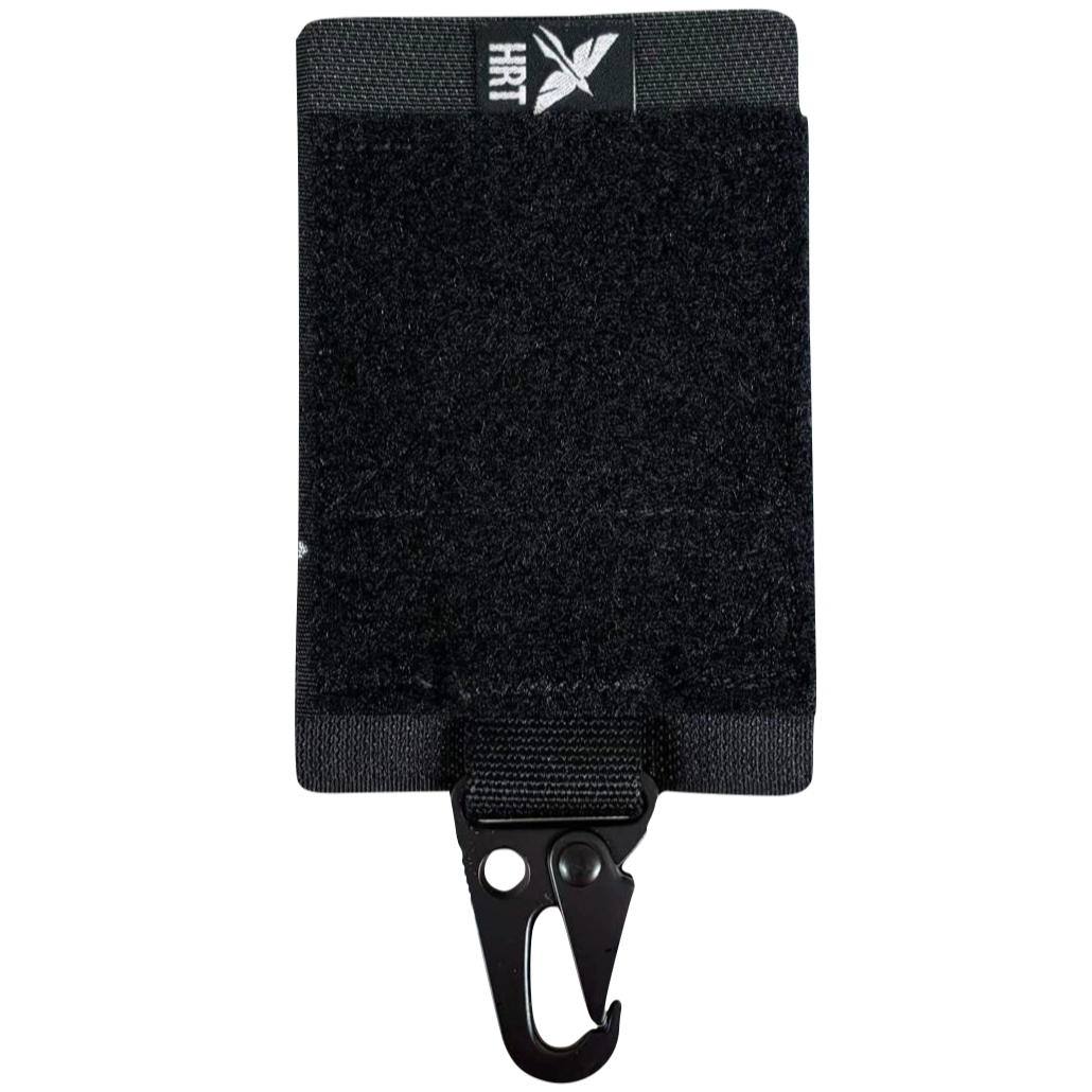 Black HCC Tactical Universal Glove Hanger mounted on a wall for convenient glove storage and organization.