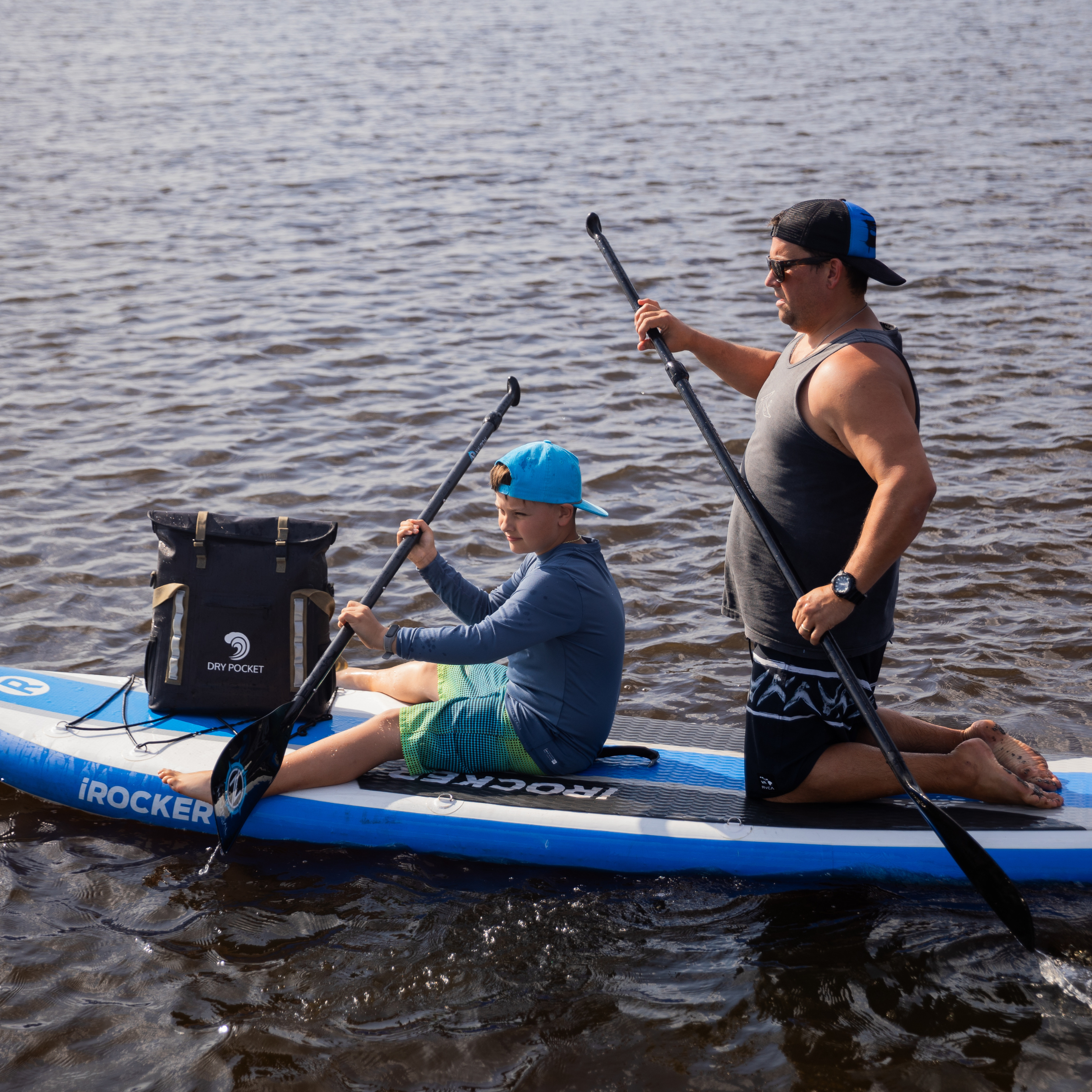 Black Dry Pocket waterproof floating tote cooler with auto-sealing lid, designed for outdoor and water activities.