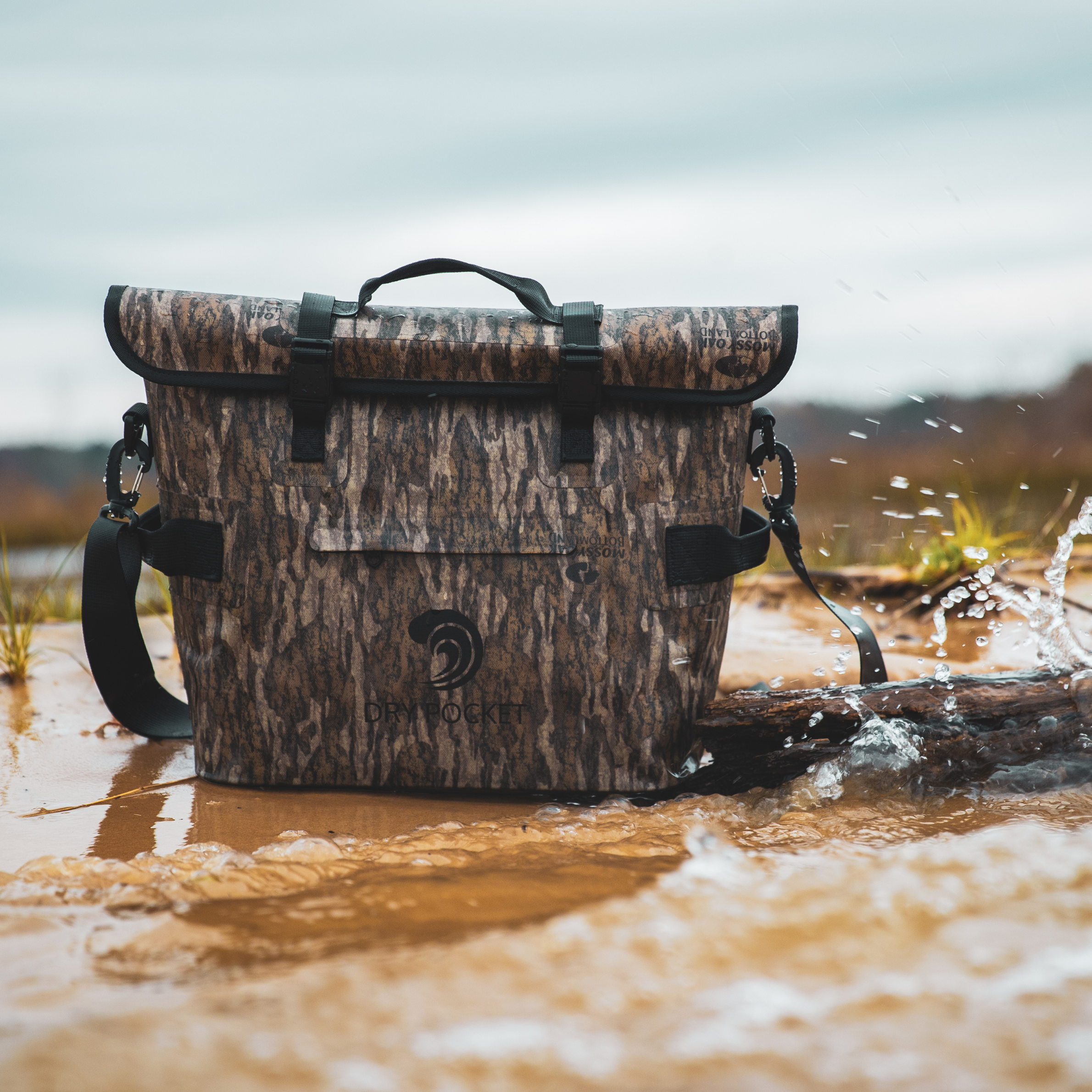 Bottomland Dry Pocket waterproof floating cooler tote with auto sealing lid, ideal for outdoor adventures and keeping drinks cold.
