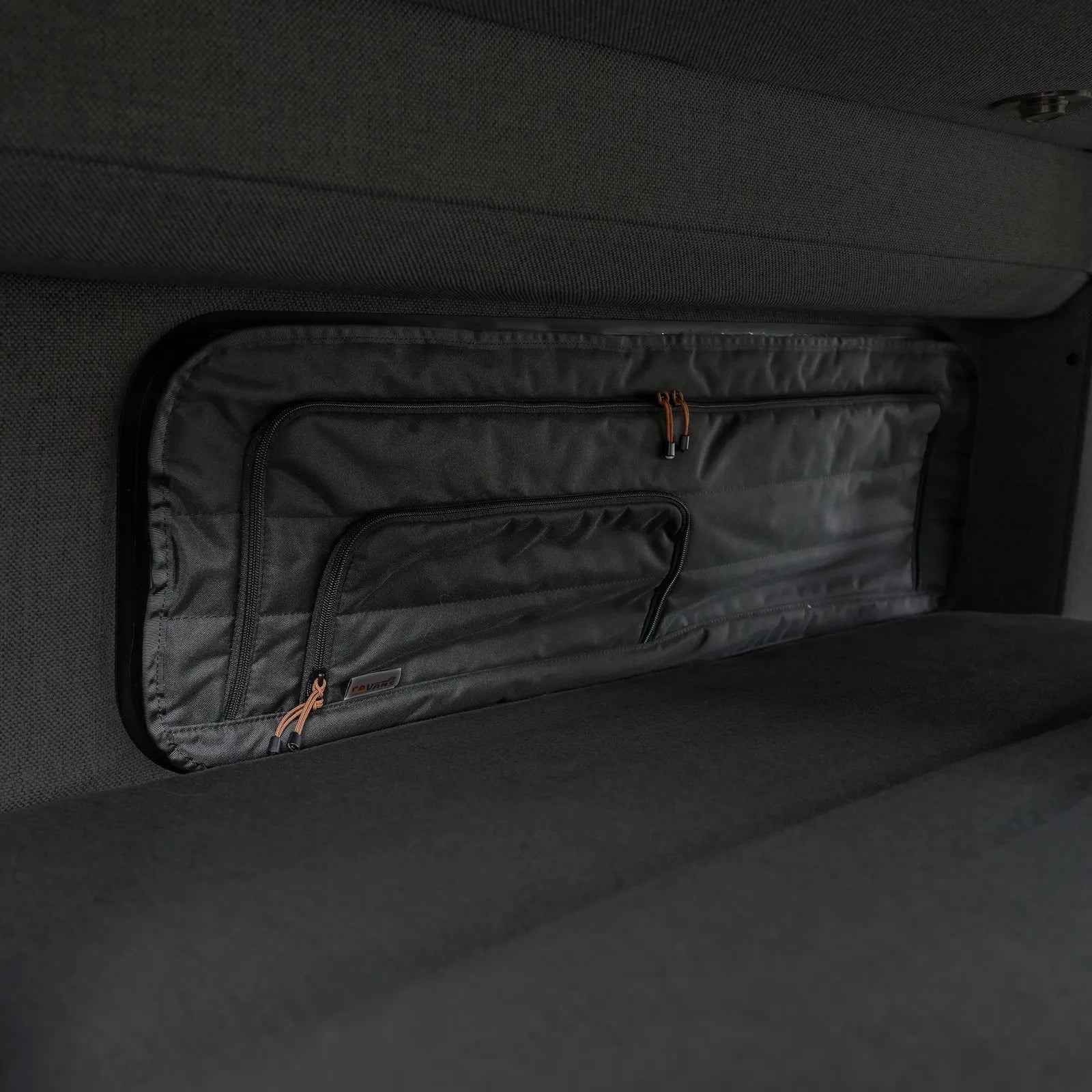 Canyon Adventure Vans CLIMA-SHADE™ insulated bunk window cover on a van, designed to block light and improve insulation in the bunk area.