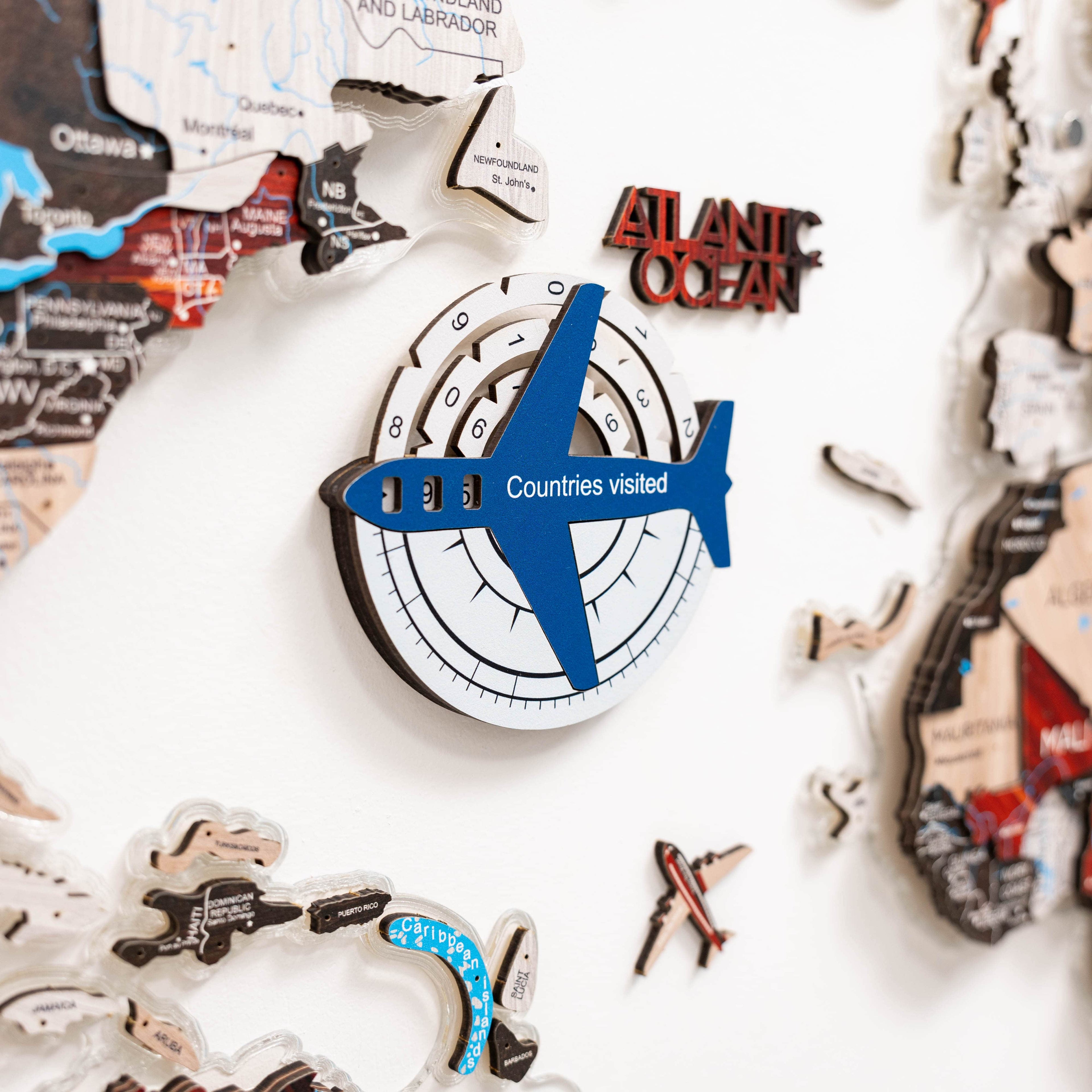 Enjoy The Wood Travel Tracker 3D colored wooden world map in aqua, featuring a detailed, colorful design for travel tracking.