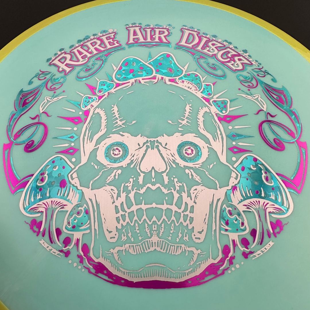 Rare Air Discs Fission Defy Crushin' Amanitas VIP 2.0 disc golf disc with vibrant design and bold branding.