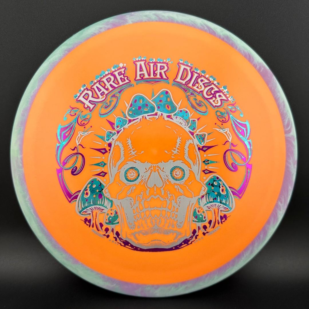Rare Air Discs Fission Defy Crushin' Amanitas VIP 2.0 disc golf disc with vibrant design and brand logo displayed.