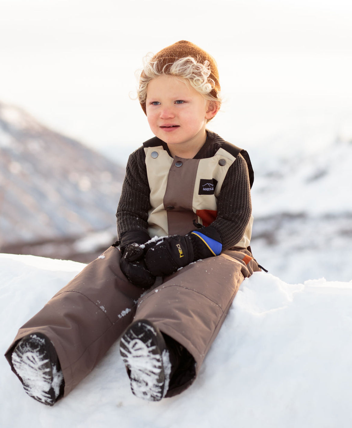 Youth and toddler waterproof snow bib by Keep the Littles Wild, featuring insulated, durable winter outerwear with adjustable straps.