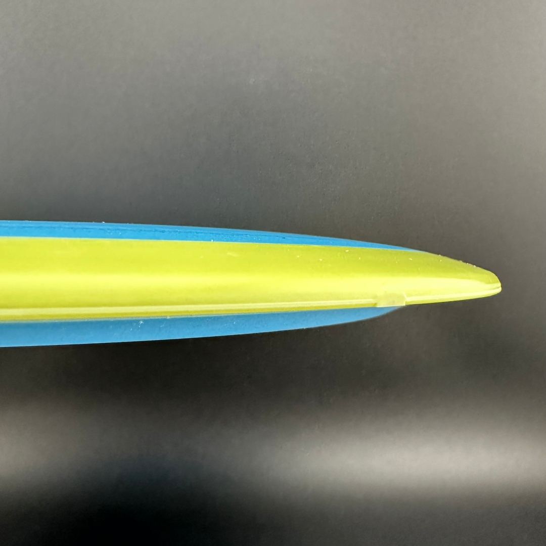 Rare Air Discs Fission Defy Crushin' Amanitas VIP 2.0 disc golf disc with colorful design and branding in hand.
