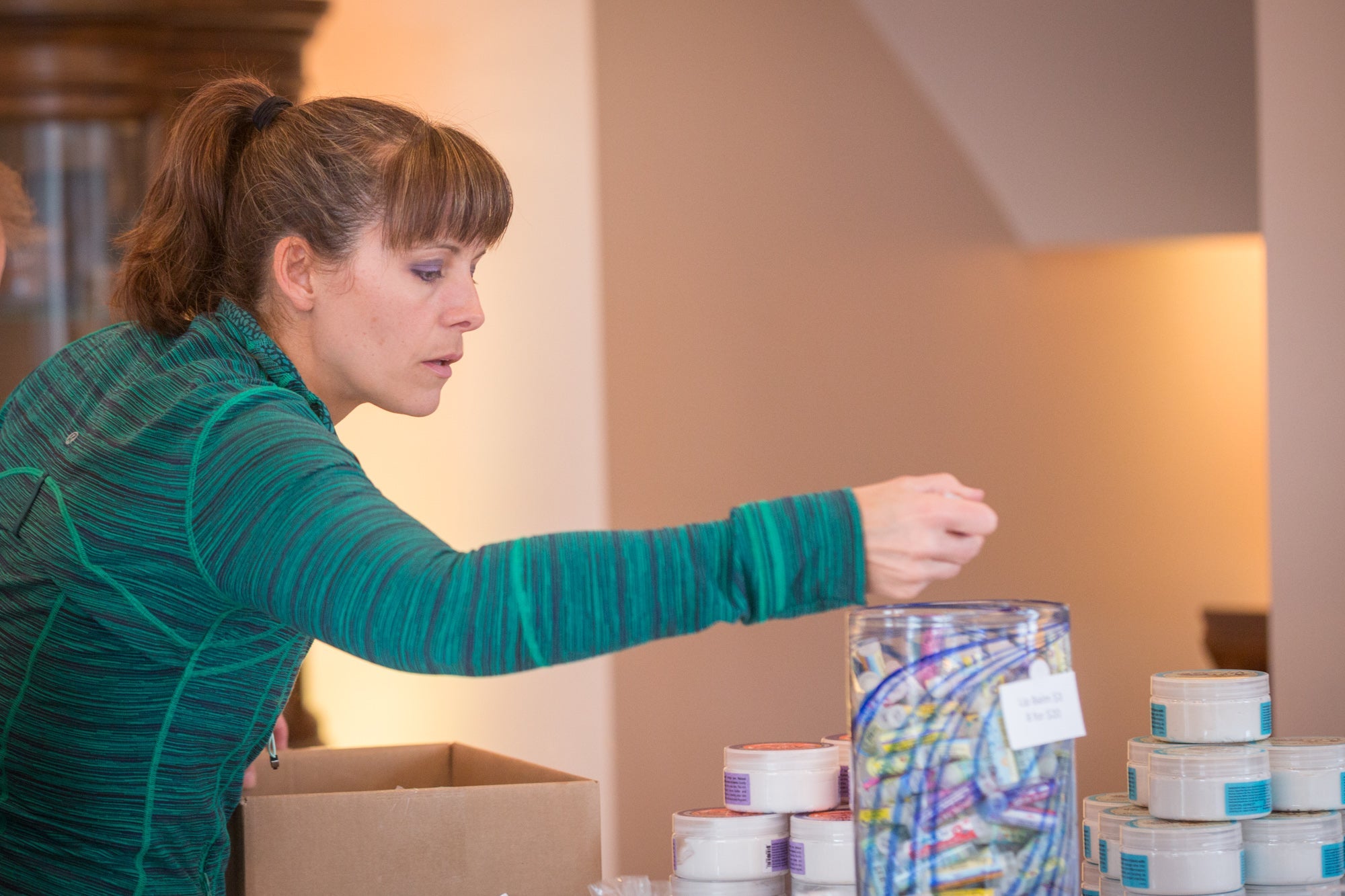 Essential Journeys Pomegranate Acai SPF 15 Lip Lube for the lips, featuring a colorful tube with natural ingredients and SPF protection.