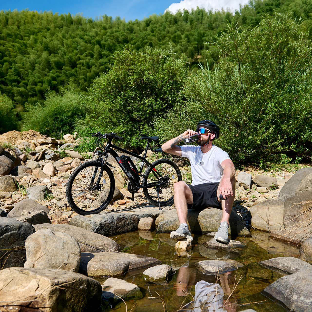 Viribus Panther electric mountain bike shown outdoors, featuring a sleek frame, fat tires, and front suspension for off-road riding.