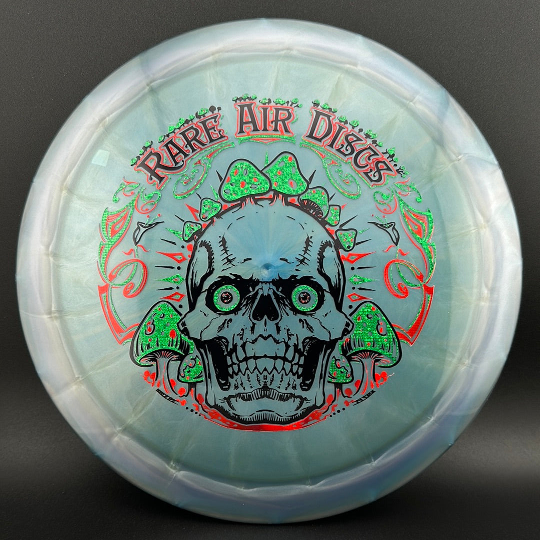 Ethos Construct Crushin' Amanitas disc golf stamp by Manny Trujillo on Rare Air Discs disc golf disc with colorful mushroom design.