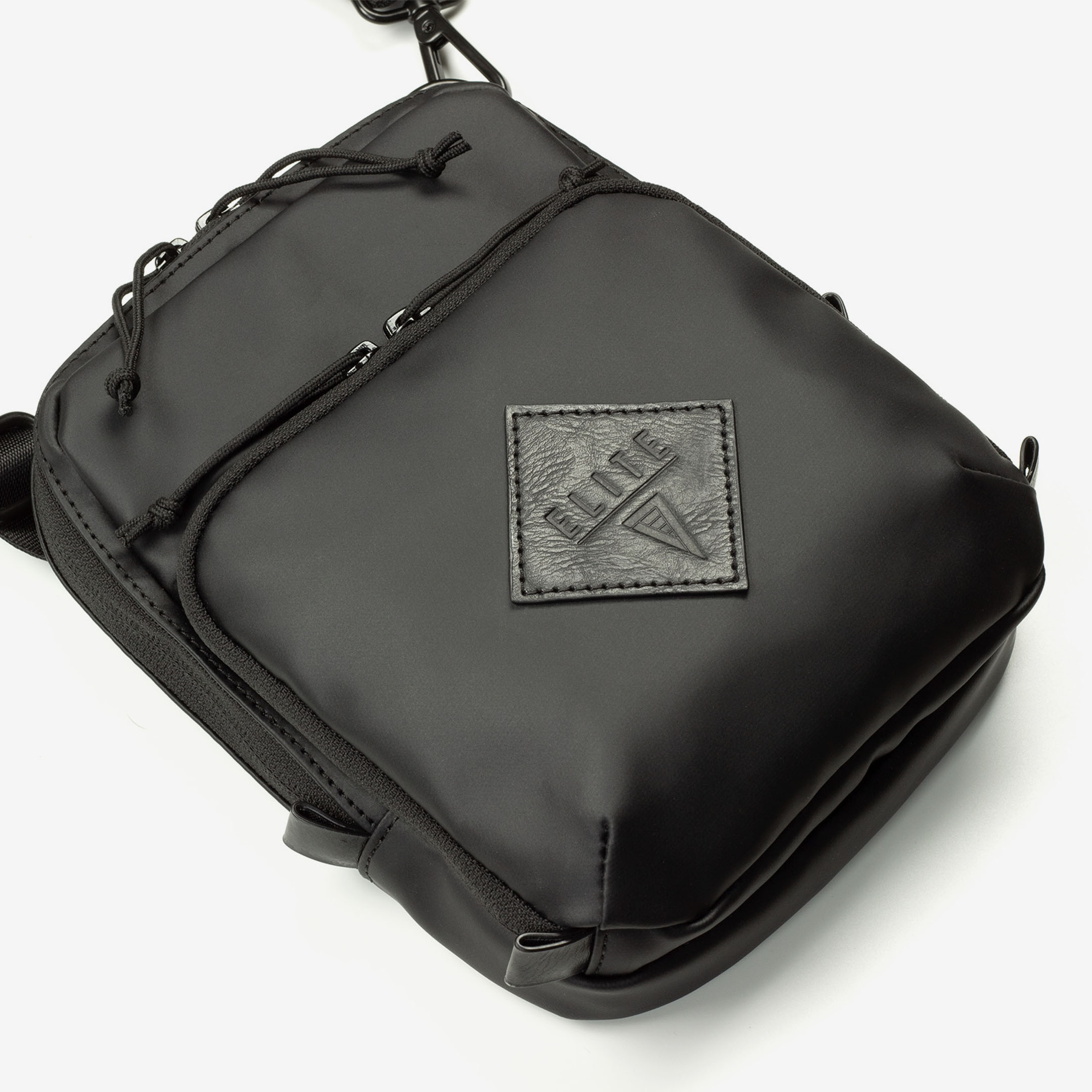 Close-up of Elite Survival Systems Microguard Mini Crossbody Concealment Pouch showing compact design and concealed carry features.