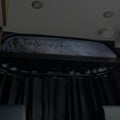 Canyon Adventure Vans CLIMA-SHADE™ insulated cab shelf cover in a vehicle interior, providing shade and insulation.