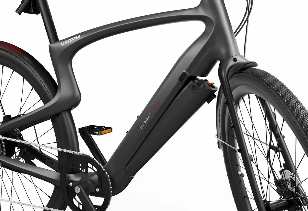 Rex E-Bikes Urtopia Carbon Classic e-bike with sleek black frame and 37c tires, showcasing its modern design and lightweight carbon build.