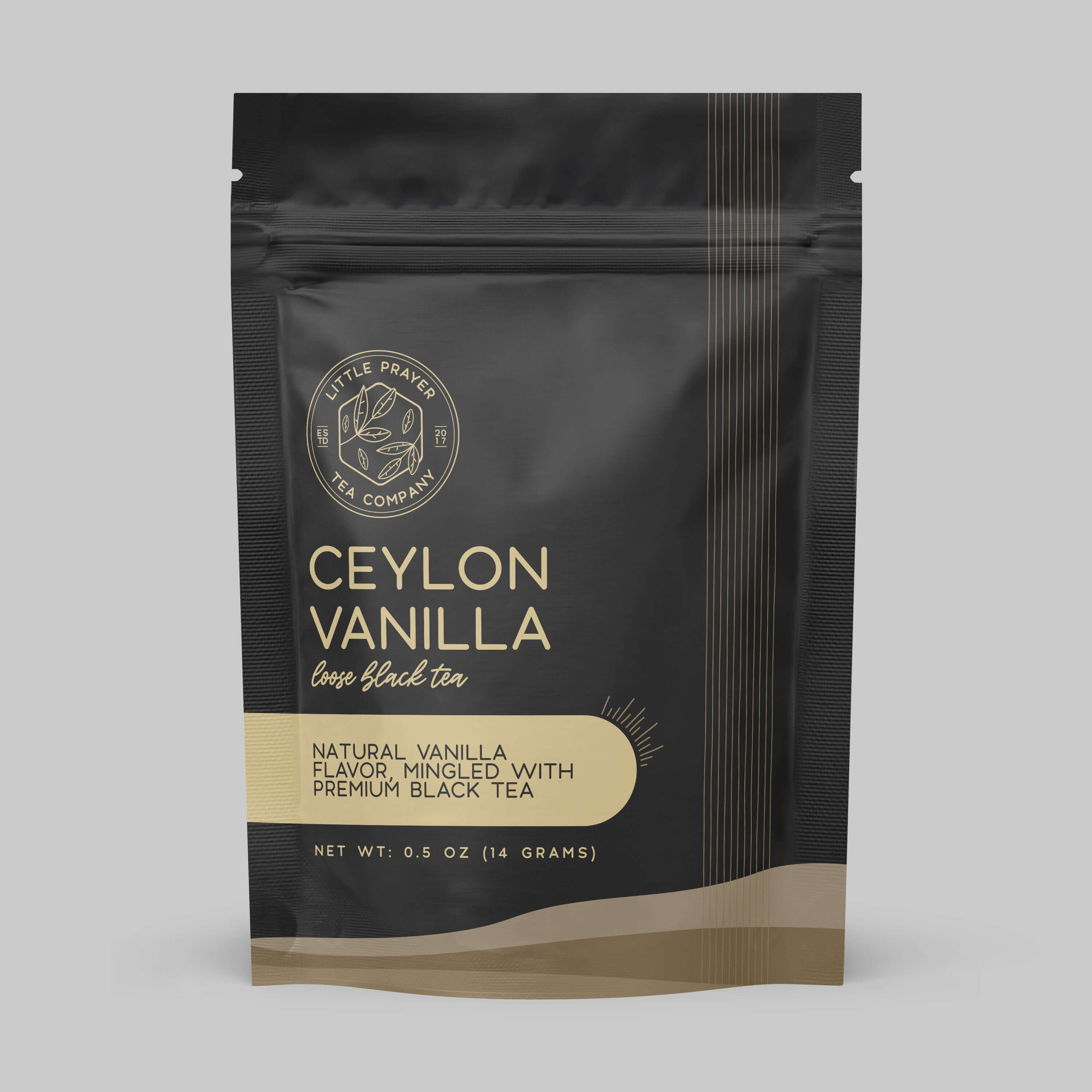 Sample of Little Prayer Tea Company's Ceylon Vanilla black tea in a clear glass cup with tea leaves and vanilla beans.