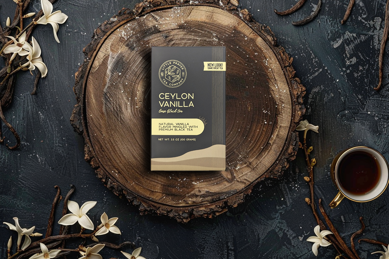 Ceylon Vanilla black tea from Little Prayer Tea Company with dried tea leaves and vanilla bean pieces in a clear container.